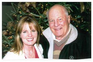 Robin and Christina Olds in front of Christmas tree in 2005.jpg